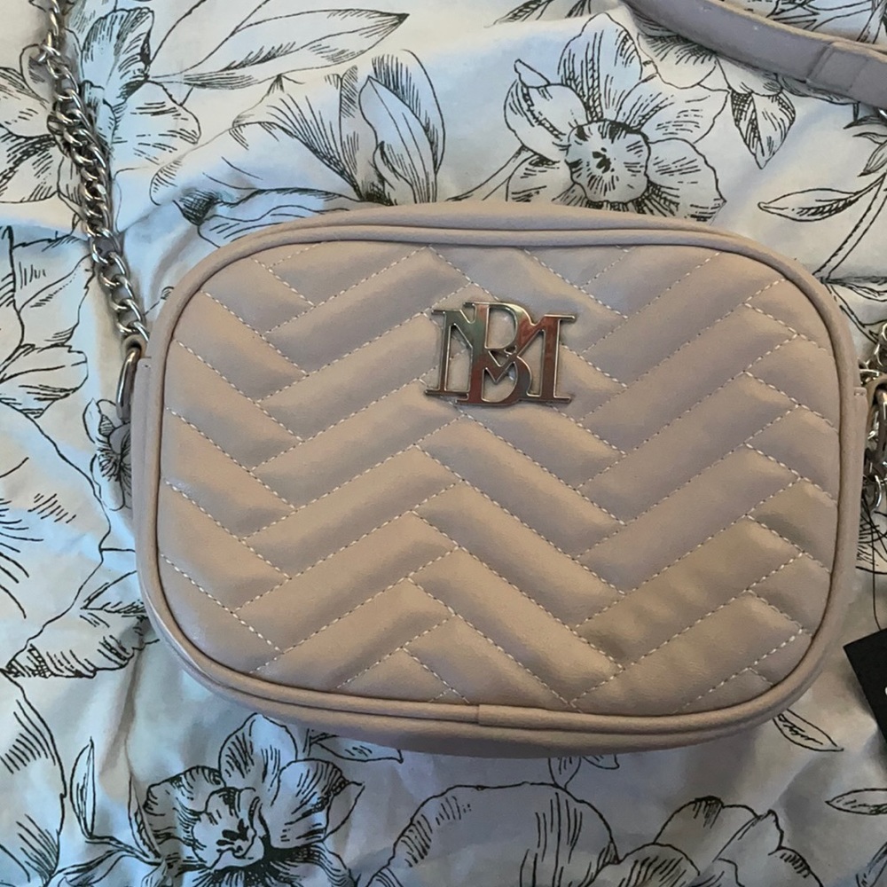 Beige purse chained